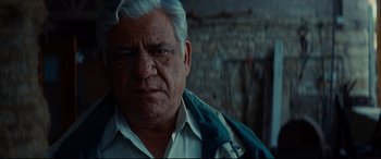 Movie still from “The Hundred-Foot Journey” (2014), directed by Lasse Hallström – An old man with a white beard and a blue jacket; Close Up shot, Low angle