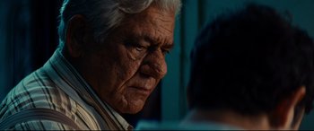 Movie still from “The Hundred-Foot Journey” (2014), directed by Lasse Hallström – An old man with a white beard looking down; Close Up shot, Low angle