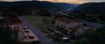 Movie still from “The Hundred-Foot Journey” (2014), directed by Lasse Hallström – An aerial view of a house with a car parked in front of it; Extreme Wide shot, High angle