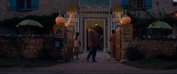 Movie still from “The Hundred-Foot Journey” (2014), directed by Lasse Hallström – A man and two women walking in front of an entrance to a building; Wide shot, Low angle
