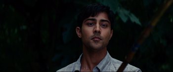 Movie still from “The Hundred-Foot Journey” (2014), directed by Lasse Hallström – A person wearing a white shirt; Close Up shot, Over the shoulder angle