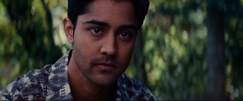 Movie still from “The Hundred-Foot Journey” (2014), directed by Lasse Hallström – A man's face in front of trees; Close Up shot, High angle