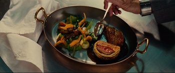 Movie still from “The Hundred-Foot Journey” (2014), directed by Lasse Hallström – A plate of food that is on a table; Extreme Close Up shot, High angle