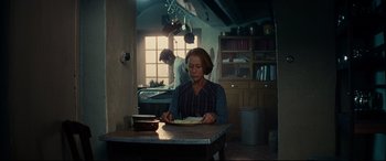 Movie still from “The Hundred-Foot Journey” (2014), directed by Lasse Hallström – A woman sitting at a table in front of a man; Medium shot, Low angle