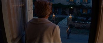 Movie still from “The Hundred-Foot Journey” (2014), directed by Lasse Hallström – A man and a woman standing in front of a building; Wide shot, High angle