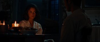Movie still from “The Hundred-Foot Journey” (2014), directed by Lasse Hallström – A woman sitting at a table in front of a man; Medium shot, Over the shoulder angle