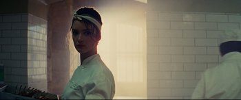 Movie still from “The Hundred-Foot Journey” (2014), directed by Lasse Hallström – A woman wearing a white shirt and a white headband; Close Up shot, Low angle
