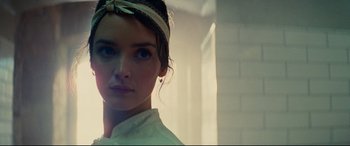 Movie still from “The Hundred-Foot Journey” (2014), directed by Lasse Hallström – A person wearing a head band; Close Up shot, Over the shoulder angle