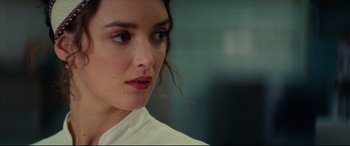 Movie still from “The Hundred-Foot Journey” (2014), directed by Lasse Hallström – A person wearing a white shirt; Close Up shot, Over the shoulder angle