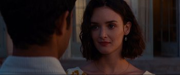 Movie still from “The Hundred-Foot Journey” (2014), directed by Lasse Hallström – A young woman looking at a young man in front of a building; Close Up shot, Over the shoulder angle