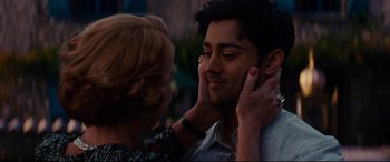 Movie still from “The Hundred-Foot Journey” (2014), directed by Lasse Hallström – A woman touching a man's face while he looks at the camera; Close Up shot, Over the shoulder angle