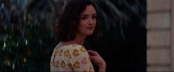 Movie still from “The Hundred-Foot Journey” (2014), directed by Lasse Hallström – A woman in a yellow and white floral dress; Close Up shot, Over the shoulder angle