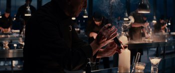 Movie still from “The Hundred-Foot Journey” (2014), directed by Lasse Hallström – A man in a chef's outfit clapping his hands in front of a table; Close Up shot, Over the shoulder angle