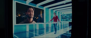 Movie still from “The Hundred-Foot Journey” (2014), directed by Lasse Hallström – A man standing in front of a mirror in a room; Medium shot, Over the shoulder angle