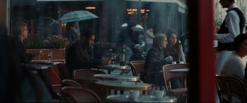 Movie still from “The Hundred-Foot Journey” (2014), directed by Lasse Hallström – A group of people sitting at a table in a restaurant; Medium shot, Over the shoulder angle