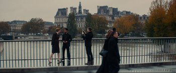 Movie still from “The Hundred-Foot Journey” (2014), directed by Lasse Hallström – A group of people standing next to each other near a body of water; Wide shot, Over the shoulder angle