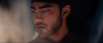 Movie still from “The Hundred-Foot Journey” (2014), directed by Lasse Hallström – A man with a beard; Close Up shot, Over the shoulder angle