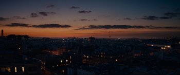 Movie still from “The Hundred-Foot Journey” (2014), directed by Lasse Hallström – A view of a city at night with the eiffel tower in the distance; Extreme Wide shot, Low angle