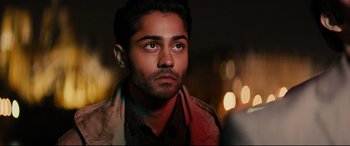 Movie still from “The Hundred-Foot Journey” (2014), directed by Lasse Hallström – A person wearing a jacket; Close Up shot, Over the shoulder angle
