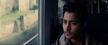 Movie still from “The Hundred-Foot Journey” (2014), directed by Lasse Hallström – A person looking out a window; Close Up shot, Over the shoulder angle