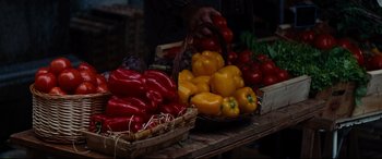 Movie still from “The Hundred-Foot Journey” (2014), directed by Lasse Hallström – Baskets of peppers and tomatoes on the table; Extreme Close Up shot, High angle