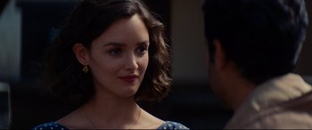 Movie still from “The Hundred-Foot Journey” (2014), directed by Lasse Hallström – A person wearing a blue dress; Close Up shot, Over the shoulder angle