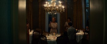 Movie still from “The Hundred-Foot Journey” (2014), directed by Lasse Hallström – A group of people sitting around a dinner table; Wide shot, Low angle