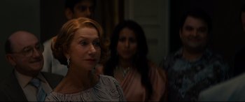 Movie still from “The Hundred-Foot Journey” (2014), directed by Lasse Hallström – A group of people standing in front of a wall; Close Up shot, Over the shoulder angle