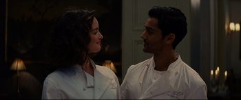 Movie still from “The Hundred-Foot Journey” (2014), directed by Lasse Hallström – A man and a woman wearing white chef's uniforms; Medium shot, Over the shoulder angle
