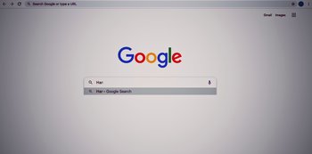 Movie still from “Press Play” (2022), directed by Greg Björkman – A computer screen showing a search engine page; Extreme Close Up shot, Low angle