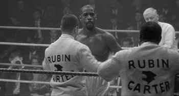 Movie still from “The Hurricane” (1999), directed by Norman Jewison – A black - and - white photo of two boxers in a boxing ring; Medium shot, Low angle