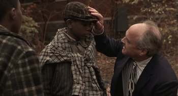 Movie still from “The Hurricane” (1999), directed by Norman Jewison – An older man touching the forehead of a young man; Close Up shot, Over the shoulder angle