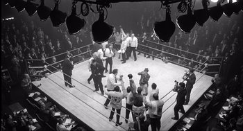 Movie still from “The Hurricane” (1999), directed by Norman Jewison – A boxing ring with a crowd of people in it; Extreme Wide shot, High angle