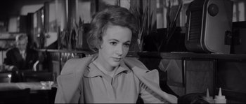 Movie still from “The Hustler” (1961), directed by Robert Rossen – A black - and - white photo of a young woman; Close Up shot, High angle