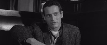 Movie still from “The Hustler” (1961), directed by Robert Rossen – Black and white photograph of a man in a jacket; Close Up shot, Over the shoulder angle