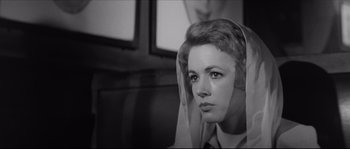 Movie still from “The Hustler” (1961), directed by Robert Rossen – A black and white photo of a woman with a veil over her head; Close Up shot, Low angle