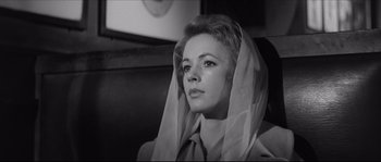 Movie still from “The Hustler” (1961), directed by Robert Rossen – A black and white photo of a woman with a head covering; Close Up shot, Low angle