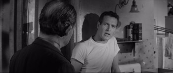 Movie still from “The Hustler” (1961), directed by Robert Rossen – A man and a woman in a room with a mirror; Close Up shot, Over the shoulder angle