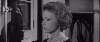 Movie still from “The Hustler” (1961), directed by Robert Rossen – A woman with a tear in her eye; Close Up shot, Low angle