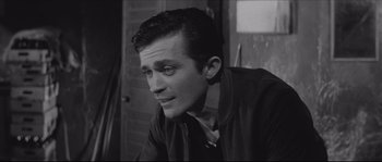 Movie still from “The Hustler” (1961), directed by Robert Rossen – Black and white photograph of a young man in a suit; Close Up shot, High angle