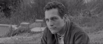 Movie still from “The Hustler” (1961), directed by Robert Rossen – Black and white photograph of a man in a field; Close Up shot, High angle
