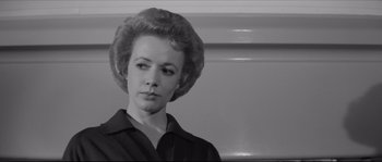 Movie still from “The Hustler” (1961), directed by Robert Rossen – A black and white photo of a woman in a black shirt; Close Up shot, Low angle