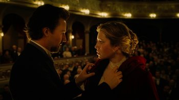 Movie still from “The Illusionist” (2006), directed by Neil Burger – A man and a woman in front of an audience; Medium shot, Low angle