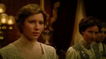 Movie still from “The Illusionist” (2006), directed by Neil Burger – A woman in a white dress standing next to another woman; Close Up shot, Over the shoulder angle