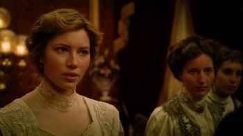 Movie still from “The Illusionist” (2006), directed by Neil Burger – A woman in a white dress standing next to another woman in a white dress; Close Up shot, Over the shoulder angle