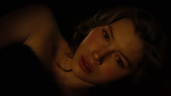 Movie still from “The Illusionist” (2006), directed by Neil Burger – A beautiful young woman with long brown curly hair; Close Up shot, High angle