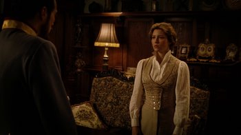 Movie still from “The Illusionist” (2006), directed by Neil Burger – A man and a woman standing in front of each other in a room; Medium shot, Over the shoulder angle
