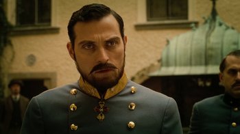 Movie still from “The Illusionist” (2006), directed by Neil Burger – A person wearing a uniform; Close Up shot, Low angle