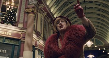 Movie still from “The Imaginarium of Doctor Parnassus” (2009), directed by Terry Gilliam – An older woman wearing a red fur coat and a hat; Medium shot, Low angle