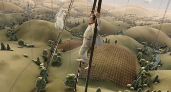 Movie still from “The Imaginarium of Doctor Parnassus” (2009), directed by Terry Gilliam – A man standing on top of a wooden ladder; Wide shot, Overhead angle